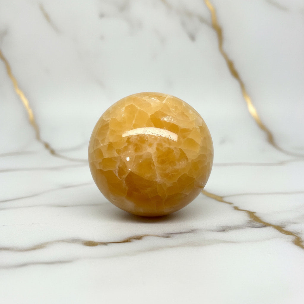 Calcit Kugel - Wärme & Kraft CrystalScents
