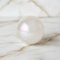 Bergkristall Aura Kugel - Schimmernde Eleganz CrystalScents