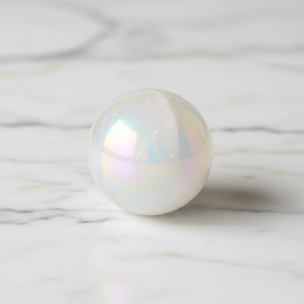 Bergkristall Aura Kugel - Schimmernde Eleganz CrystalScents