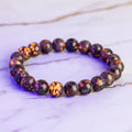 Flammenstein Yooperlite Kugelarmband – Mystisches Leuchten CrystalScents